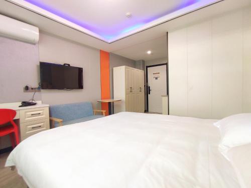 Yiwu Jun'an Hotelにあるベッド