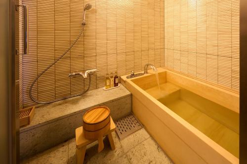 a bathroom with a toilet sitting next to a tub at MAIHAMA VIEW HOTEL by HULIC Formerly Tokyo Bay Maihama Hotel in Urayasu