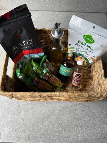 a basket filled with different types of beer and condiments at Casa Prana, Termales, Nuqui in Nuquí