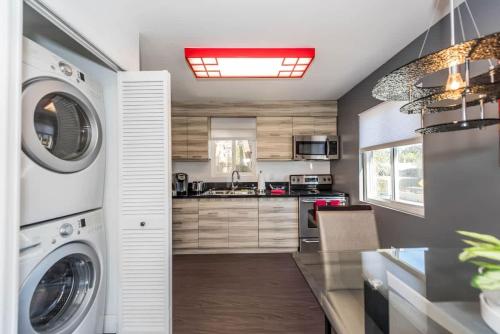 a kitchen with a washer and dryer at Canyon View in San Diego