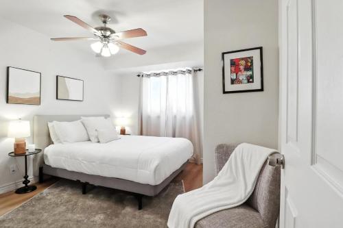 a bedroom with a bed and a ceiling fan at Osborn Oasis | Short Walk to Old Town Scottsdale in Scottsdale