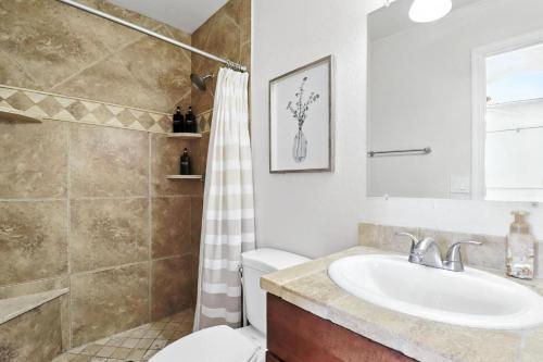 a bathroom with a sink and a toilet at Osborn Oasis | Short Walk to Old Town Scottsdale in Scottsdale