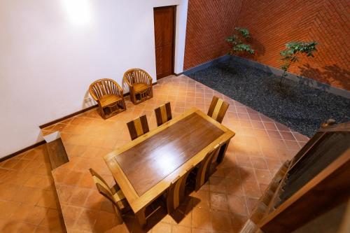 an overhead view of a dining room with a table and chairs at Ceylon Holiday Homes in Kandy