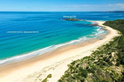 an aerial view of a beach in the ocean at Souira Beach House in Manyana