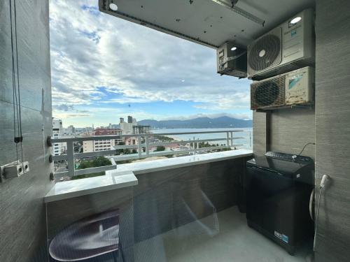 a balcony with a view of a city skyline at Da Nang Daisy Apartment in Danang