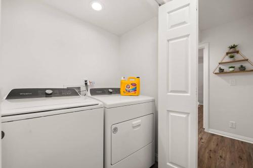 a white kitchen with a stove top oven next to a door at October Sale! 35 Off- Near Lax, Parking Wifi in Los Angeles