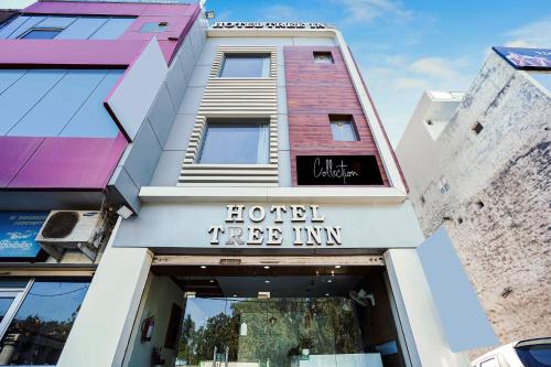a hotel tree inn sign on the front of a building at Hotel O Tree Inn in Zirakpur