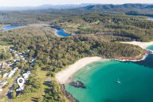 an aerial view of a beach and the ocean at Mherringa at Bawley - enjoy panoramic ocean views in Bawley Point