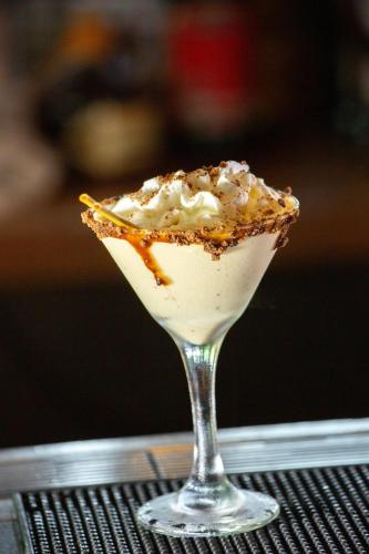 a dessert in a martini glass on a table at Kokomo Botanical Resort - Caribbean Family Cottages in Turtle Cove