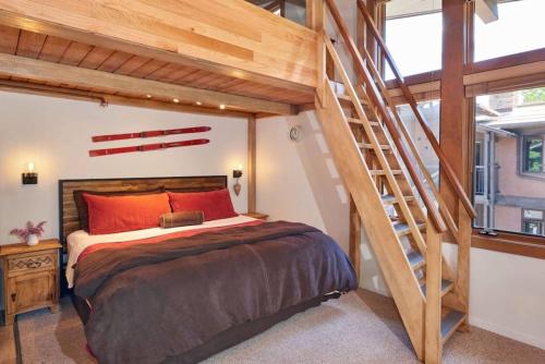 a bedroom with a loft bed and a staircase at Charming 3-bed Studio W Family-friendly Loft in Snowmass Village