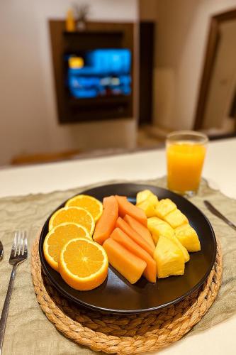 a plate of fruit and vegetables on a table at Jungle Guardian - Rooftop Pool & Beach Club in Zona Hotelera Tulum in Tulum
