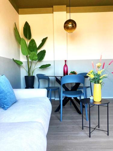 a living room with a couch and a table at Green Suite 88 in Treviso