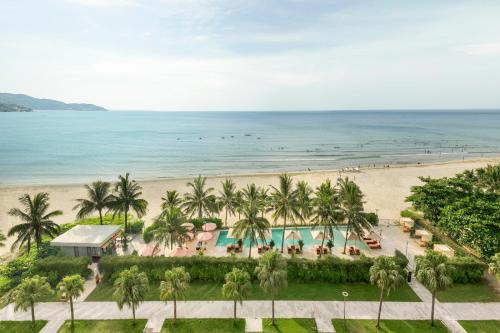 an aerial view of a resort with a beach at Signature by M Village Beachfront Hotel in Da Nang