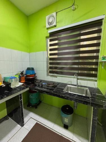 Kuchyň nebo kuchyňský kout v ubytování Siti Homestay Unit 1 Langkawi