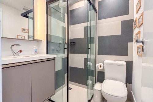 a bathroom with a toilet and a shower at BSide Faria Lima Pinheiros in Sao Paulo
