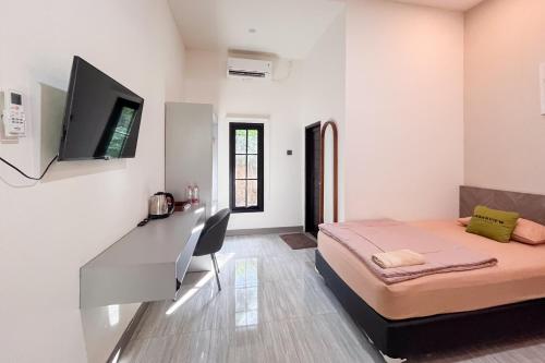 Urbanview DSulthan Guest House Syariah IKNにあるベッド