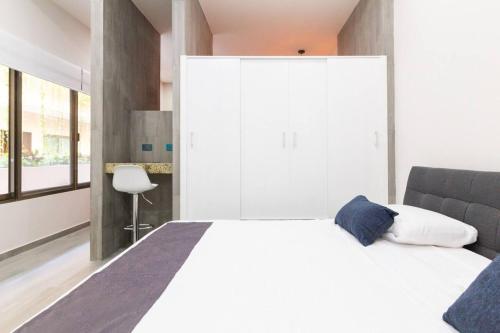 Ένα ή περισσότερα κρεβάτια σε δωμάτιο στο Departamento En El Centro De Playa Del Carmen