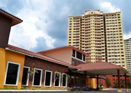 a building with two tall buildings in the background at A'Famosa Resort Melaka in Melaka