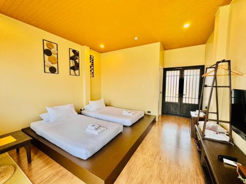 Postel nebo postele na pokoji v ubytování COZY SHIROI RESORT