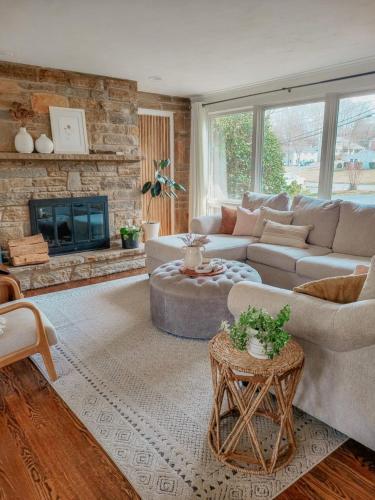 a living room with a couch and a fireplace at The Cambridge in Warrane