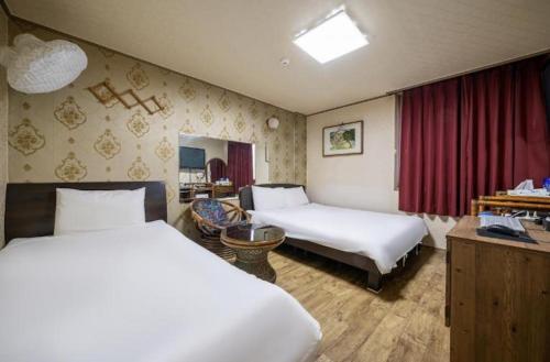 Katil atau katil-katil dalam bilik di Jeju Top Motel