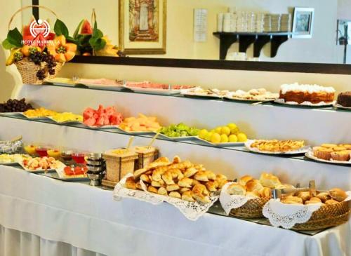 a buffet with many different types of food on display at Hotel Marbella in Punta del Este