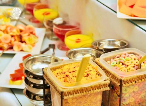 a counter with some food in containers on a table at Hotel Marbella in Punta del Este