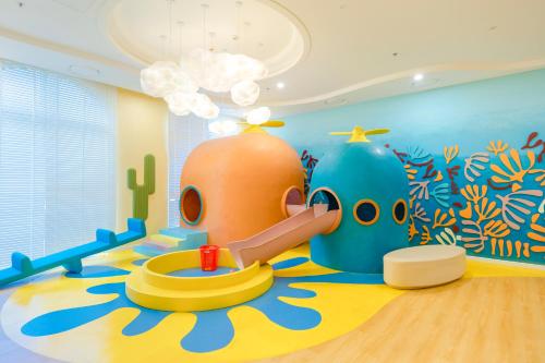 a childrens room with a play area with a play implement at The Hill Apartment - Phú Quốc - Firework & Ocean View in Phu Quoc