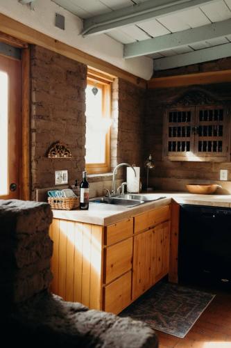 a kitchen with a sink and a counter top at Stay Old Town Road in Albuquerque