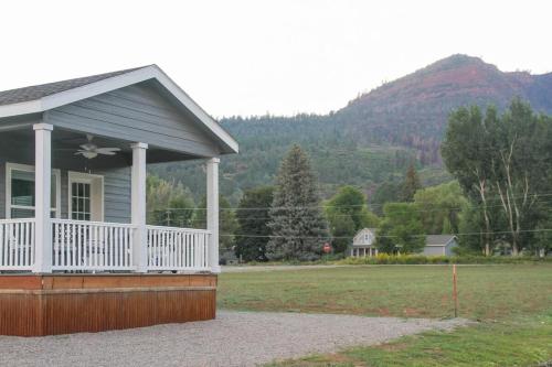 a small house with a porch and a field at Outstanding Views Just North Of Durango in Hermosa