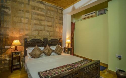 Ein Bett oder Betten in einem Zimmer der Unterkunft Hotel Rajmandir