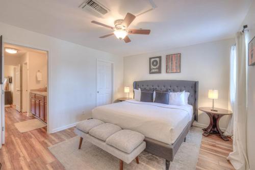 a bedroom with a bed and a ceiling fan at Riverfront Retreat-Near Broadway, Pool, Park Free in Nashville
