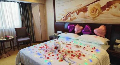 Letto o letti in una camera di Vienna Hotel Nanning Train Station