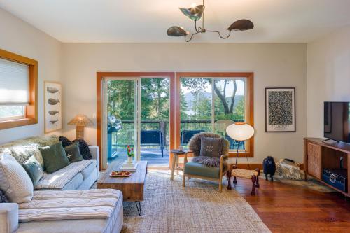 a living room with a couch and a tv at Beautiful Waterviews, Pet-friendly, Close To Town in Eastsound