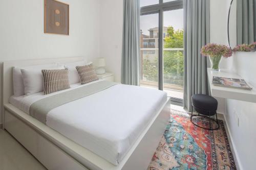 Cama o camas de una habitación en Frank Porter - Avencia, Damac Hills 2