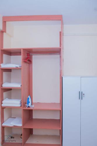 a bunk bed with a door in a room at Ferrum Apartments in Eldoret