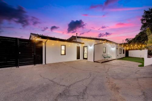 a house with a garage at night at 4BR Hilltop Villa by Universal Studios with Pool and Amazing Views in Los Angeles