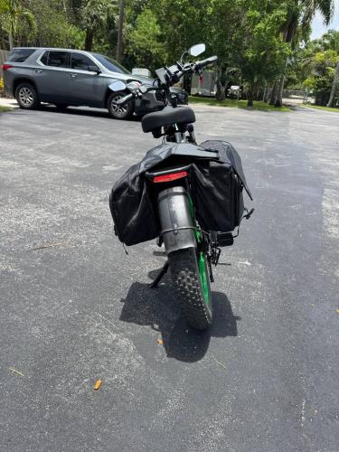 a motorcycle is parked in a parking lot at Olive Studio Apart Unit 2 By Pmi in West Palm Beach