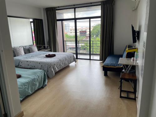 Katil atau katil-katil dalam bilik di SLEEPY-Homey Don Mueang Airport Hostel