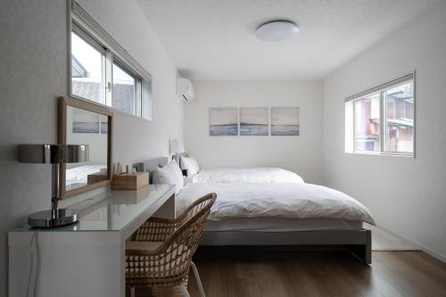 Ένα ή περισσότερα κρεβάτια σε δωμάτιο στο Gray House
