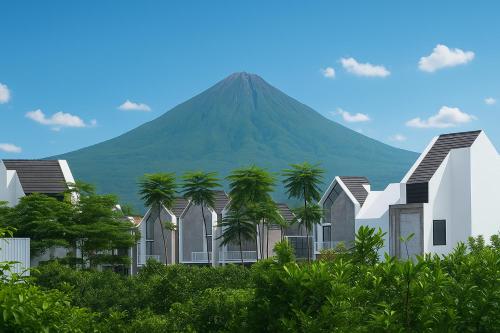 ein Berg im Hintergrund mit Häusern und Palmen in der Unterkunft Villa Iblink"Aesthetic & Homely in Malang" in Malang