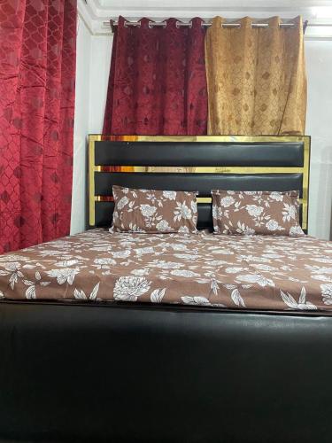 a bed with two pillows on top of it at Hotel Gokul International Bhadarwah in Doda