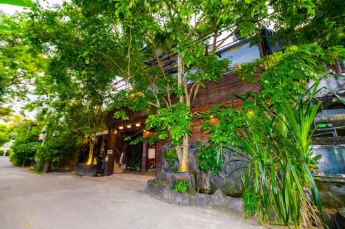 a building with plants on the side of it at Wood Land Airport residences in Seeduwa