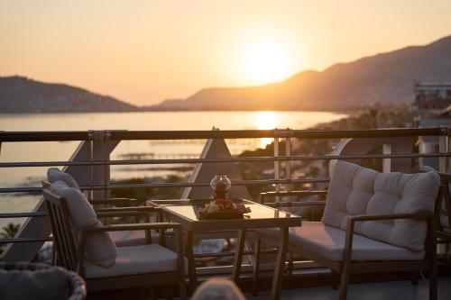 a balcony with a table and chairs on a cruise ship at Hotel Grand Kaptan - Ultra All Inclusive in Alanya