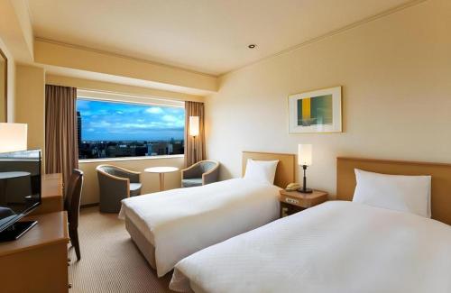 Un ou plusieurs lits dans un hébergement de l'établissement Century Royal Hotel Sapporo