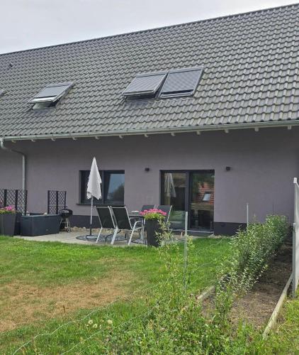 a house with solar panels on the roof at Ferienwohnung Alter Stall Burg in Burg