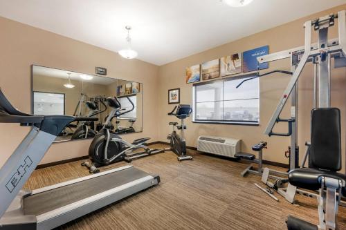 a gym with treadmills and exercise equipment in a room at Comfort Inn I-20 Midland Stanton in Stanton