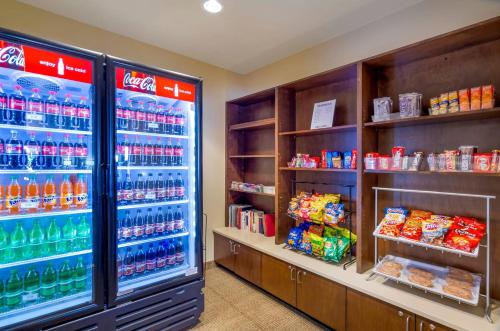 a grocery store with a large refrigerator filled with drinks at Comfort Inn & Suites Lynchburg Airport - University Area in Lynchburg