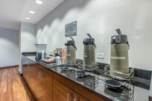 a kitchen with two kettles on a counter at MainStay Suites St Louis Airport in Bridgeton