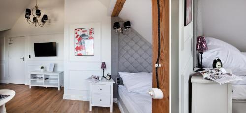 1 dormitorio pequeño con 1 cama y TV en Lion Apartments - CHILLSET Apartmenty Westerplatte en Sopot